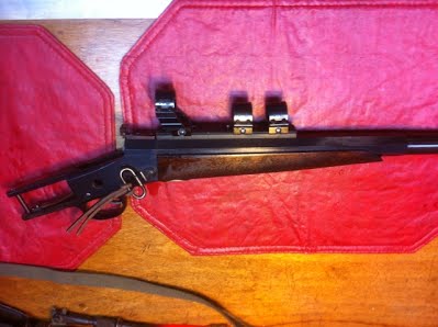 The rolling block rifle, the gun oil is shining off the rolling block rifle.